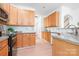 Bright kitchen with light wood cabinets, granite counters, and white subway tile backsplash at 14923 Almondell Dr, Huntersville, NC 28078