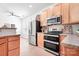 Well-lit kitchen featuring stainless steel appliances and modern fixtures at 14923 Almondell Dr, Huntersville, NC 28078