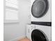 Compact laundry area with stacked washer and dryer, maximizing space at 14923 Almondell Dr, Huntersville, NC 28078
