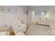 This bedroom boasts board and batten accent walls, neutral decor, and ensuite bathroom access at 15216 Shallow Ridge Rd, Charlotte, NC 28278