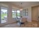 Bright breakfast nook with a modern light fixture and backyard views, creating a cozy dining experience at 15216 Shallow Ridge Rd, Charlotte, NC 28278