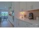Modern kitchen with white cabinets, stainless steel appliances, and sleek countertops at 15216 Shallow Ridge Rd, Charlotte, NC 28278