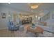 Spacious open-concept living room with staircase, hardwood floors, and views to the kitchen at 15216 Shallow Ridge Rd, Charlotte, NC 28278