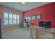 Bright office room with large windows, modern desk, and neutral decor at 15216 Shallow Ridge Rd, Charlotte, NC 28278