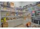 Walk-in pantry with ample shelving for organized storage, ideal for groceries and kitchen essentials at 15216 Shallow Ridge Rd, Charlotte, NC 28278