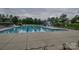 Outdoor swimming pool area with lap lanes, leisure area, diving board, and various amenities at 15216 Shallow Ridge Rd, Charlotte, NC 28278