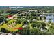 Scenic aerial view near Birkdale Village, Robbins Park, and Lake Norman with lush greenery at 18745 Bluff Point Rd, Cornelius, NC 28031
