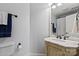 Bathroom with classic vanity and fixtures, toilet and towel rack at 18745 Bluff Point Rd, Cornelius, NC 28031
