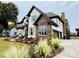 Two-story home featuring stone accents, a well-manicured lawn, and a two-car garage at 18745 Bluff Point Rd, Cornelius, NC 28031