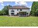 Charming two-story home featuring a well-maintained lawn, back porch, and outdoor space at 18745 Bluff Point Rd, Cornelius, NC 28031