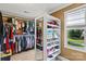Organized walk-in closet with shelving and natural light at 18745 Bluff Point Rd, Cornelius, NC 28031