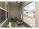 Relaxing balcony space with outdoor seating, a small table, and serene views of the surrounding community at 20216 Shaffer Bach Ln, Charlotte, NC 28277