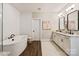 Bathroom features a soaking tub, double vanity with modern sinks and neutral color palettes at 20216 Shaffer Bach Ln, Charlotte, NC 28277