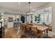 Open concept dining room with wooden table, pendant lighting, and modern decor at 20216 Shaffer Bach Ln, Charlotte, NC 28277