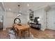 Bright dining room with hardwood floors, modern lighting, and stylish accents at 20216 Shaffer Bach Ln, Charlotte, NC 28277