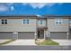Charming townhome with a two-car garage, covered entry, and well-manicured lawn at 20216 Shaffer Bach Ln, Charlotte, NC 28277