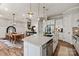 Open-concept kitchen features a large island, stainless appliances, and seamless flow to the dining area at 20216 Shaffer Bach Ln, Charlotte, NC 28277