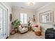 Cozy sitting room with comfortable chairs, art, stylish decor, and bright natural light at 20216 Shaffer Bach Ln, Charlotte, NC 28277