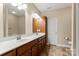 Bathroom featuring double sinks, spacious counters, and ample storage space at 207 Crystal Springs Ln, Shelby, NC 28150