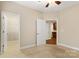 Bedroom with carpet and two doorways leading to a walk-in closet and other rooms at 207 Crystal Springs Ln, Shelby, NC 28150