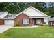 Beautiful brick home with a well-maintained lawn, attached garage, and appealing curb appeal at 207 Crystal Springs Ln, Shelby, NC 28150