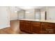 Open-concept kitchen flowing into the living area, highlighted by a granite island and wood flooring at 207 Crystal Springs Ln, Shelby, NC 28150