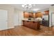 Spacious kitchen with stainless steel appliances, granite countertops, and wood cabinets at 207 Crystal Springs Ln, Shelby, NC 28150