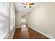 Living room featuring hardwood floors, lots of windows and arched doorways at 207 Crystal Springs Ln, Shelby, NC 28150