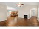 Open-concept living room flows into the kitchen, featuring a fireplace and wood flooring at 207 Crystal Springs Ln, Shelby, NC 28150