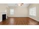 Spacious living room features a fireplace, wood floors, and large windows for natural light at 207 Crystal Springs Ln, Shelby, NC 28150