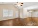Bright and airy living room with wood floors, large windows, and a decorative front door at 207 Crystal Springs Ln, Shelby, NC 28150