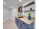 Stylish bar area features custom cabinetry, shelving, and a modern sink at 2143 Manawa Ln, Tega Cay, SC 29708