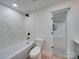 Modern bathroom with tiled shower and contemporary fixtures at 2143 Manawa Ln, Tega Cay, SC 29708