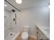 Modern bathroom featuring white marble tile, a walk-in shower, and a sleek vanity at 2143 Manawa Ln, Tega Cay, SC 29708