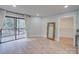 Bright bedroom with wood floors, sliding door to deck with wooded views, and a large mirror at 2143 Manawa Ln, Tega Cay, SC 29708