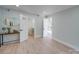 Spacious bedroom featuring light wood floors and access to a bathroom and additional rooms at 2143 Manawa Ln, Tega Cay, SC 29708