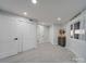 Large bedroom with closets, natural light, and neutral walls at 2143 Manawa Ln, Tega Cay, SC 29708