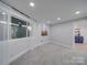 Bright bedroom featuring large window and carpeted flooring at 2143 Manawa Ln, Tega Cay, SC 29708
