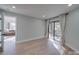 Bright bedroom featuring wood floors, a neutral paint color, and sliding door to deck at 2143 Manawa Ln, Tega Cay, SC 29708
