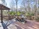 Large deck with an outdoor dining area, perfect for enjoying the natural wooded scenery at 2143 Manawa Ln, Tega Cay, SC 29708
