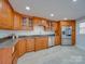 Modern kitchen showcasing stainless steel appliances, granite countertops, and custom cabinetry at 2143 Manawa Ln, Tega Cay, SC 29708