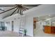 Open living area with a vaulted ceiling, ladder access to a loft, and kitchen access at 2143 Manawa Ln, Tega Cay, SC 29708