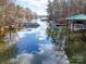 Picturesque waterfront view showcasing a variety of boats and docks along a tranquil waterway at 2143 Manawa Ln, Tega Cay, SC 29708