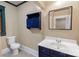 Modern half-bath with vessel sink and decorative blue vanity at 224 E Steele St, Salisbury, NC 28144