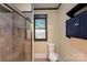 Bathroom with tiled shower, modern fixtures, and classic design at 224 E Steele St, Salisbury, NC 28144