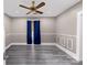 The bedroom has a modern ceiling fan and wood-look flooring at 224 E Steele St, Salisbury, NC 28144