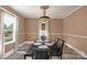 Well-lit dining room with a table set for a meal, complemented by neutral wall colors at 224 E Steele St, Salisbury, NC 28144