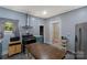 Updated kitchen with stainless steel appliances, open layout, and modern vent hood at 224 E Steele St, Salisbury, NC 28144