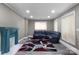 Cozy living room featuring modern flooring, a fireplace, and a comfortable sectional sofa at 224 E Steele St, Salisbury, NC 28144