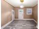 Bright living room with natural light features wood-look floors at 224 E Steele St, Salisbury, NC 28144